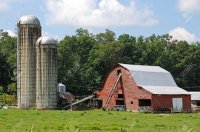5541569-working-farm-with-old-red-barn-and-grain-silos.jpg