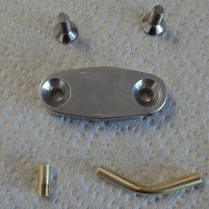 Custom fuel tank fitting parts to eliminate the petcock(s), one shown