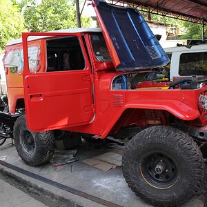 red test paint, my two year project (so far) diesel engine out of a bus, 70 series running gear, independent rear brakes, 23 inch frame clearance, wil