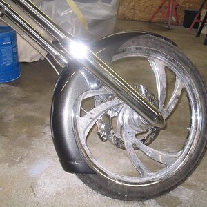 It started out as a bulk fender from W.C.choppers,after cutting the shape I lengthen the bottom and added 1/8" thick apron for strength and it gave it