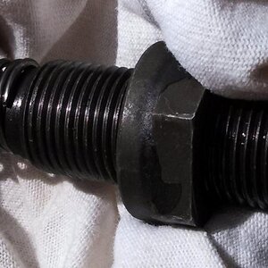 cam chain adjuster 5 shows the override of the last coil of the spring when installed incorrectly.