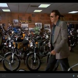 Mr. Oates strolls through our sales showroom.
Early '75 bikes everywhere.