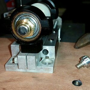 The grinder has an 8mm ID spindle, so it can also grind valve tips.
Junk valve chucked up.  Note crazing/cracking of tip.