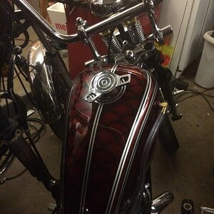 View of tank top with spinner chrome gas cap and springer dog bones.