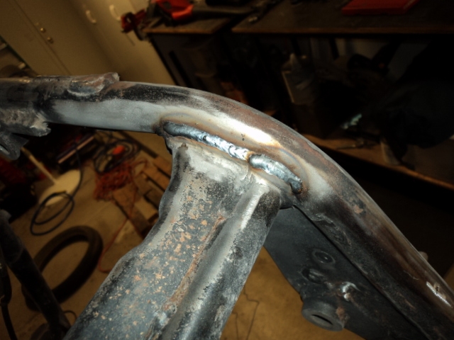 Center stand and other brackets removed.  Welded the remaining center stand lip to fill in v-groove.