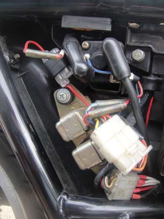 There was some discussion of the fuse on the 1979 Standard.  Here is the OEM setup showing the single fuse that came on the bike.  Turn your monitor 9
