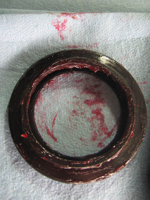 e-caliper-dust-boot-smeared-with-red-rubber-grease.jpg