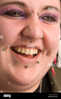 young-punk-goth-welsh-woman-she-has-multiple-facial-piercings-uk-APK48N.jpg