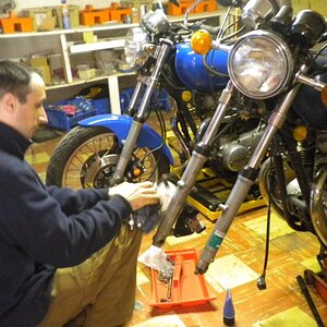Chris working on my bikes. My son is my chief mechanic. We have almost 20 bikes between us from 1962 to 2009.