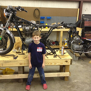 December buildoff update photo with my oldest, Eli. Got the bike partially stripped down.