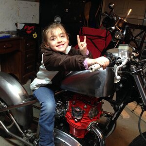 Quick pic after my lil girl and I got the gas tank rubber mounted on the bike.