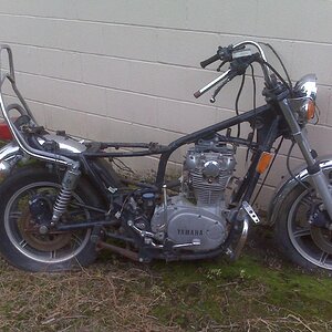 This is the bike as I got her.  It had been sitting under the drain side of a tin roof.  Lots of surface rust.