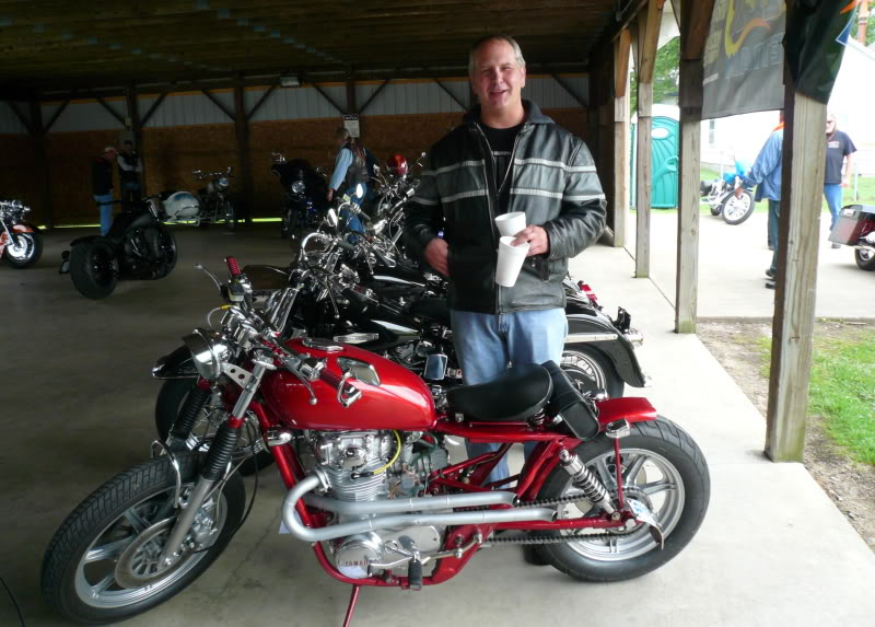 Me and the Red Rocket at the Hot rods & Harley show in Mullikan MI 2010. Those aren't beers I'm holding, but coffee cups. I was cold that morning.