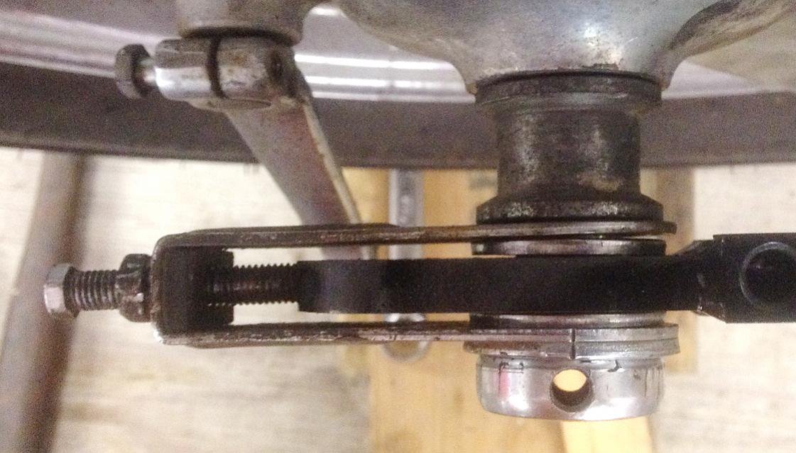 The stainless steel spaces go on either side of the axle plate, inside the chain tensioners.